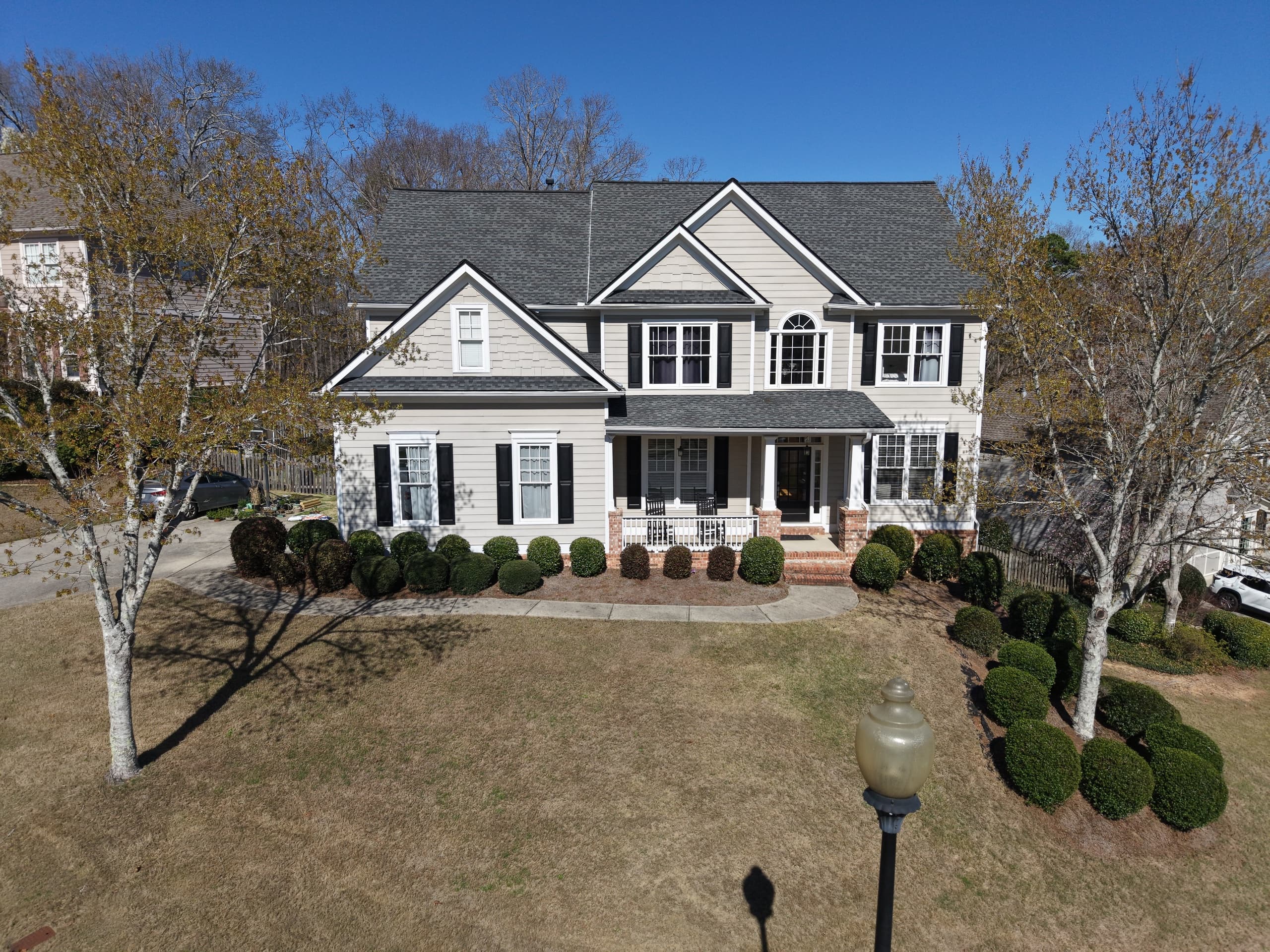 Front view of a two-story home from a low drone angle